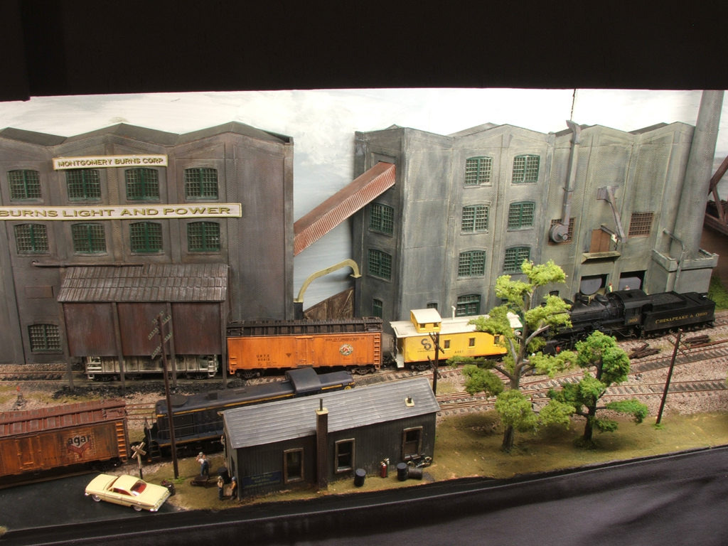 A busy time at Mason's Bridge Yard. The depot building in the foreground is completely scratchbuilt from plasticard.