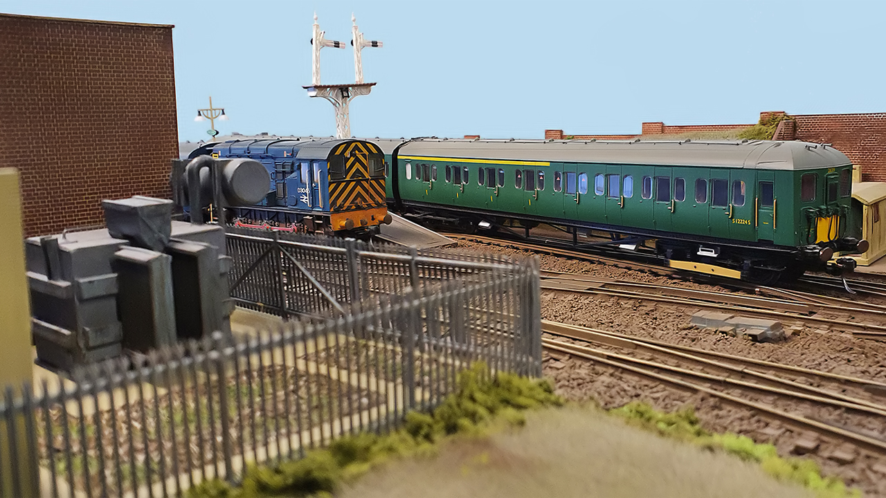 A view of West Sands. A 2-Hal EMU departure, whilst a Class 08 shunter waits to shunt the newspapers train.