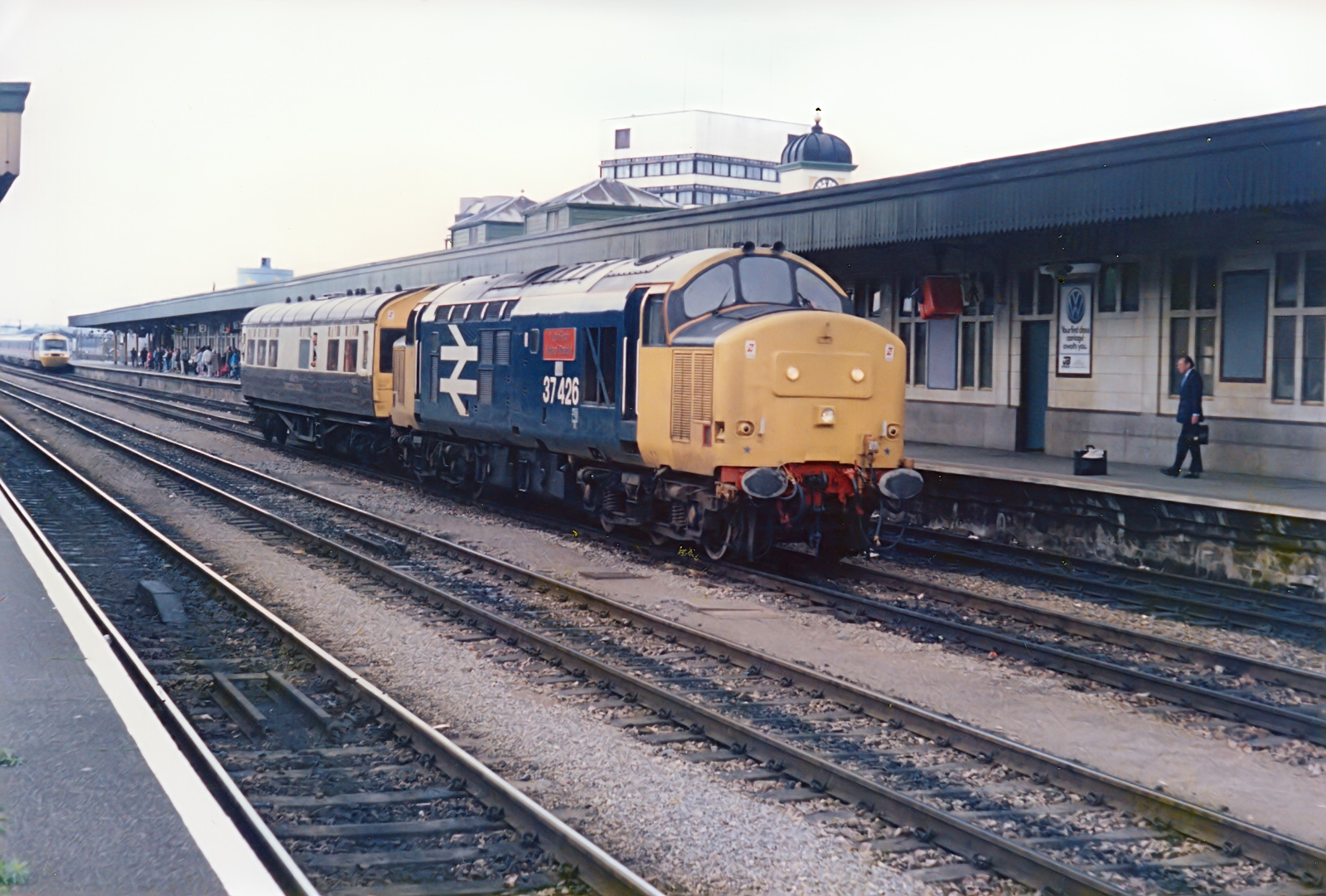 Class 37426 Y Lein Fach / Vale of Rheidol heads an ex-GWR observation saloon through Cardiff station in the late 80s.