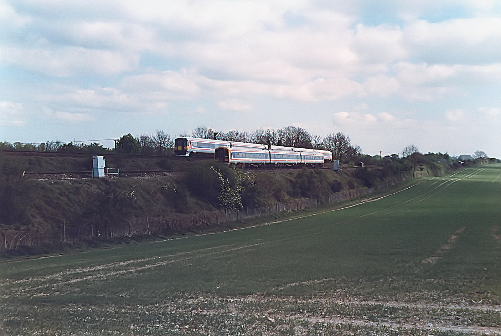 An unidentified 442 and 159 pass each other at Worting Junction.